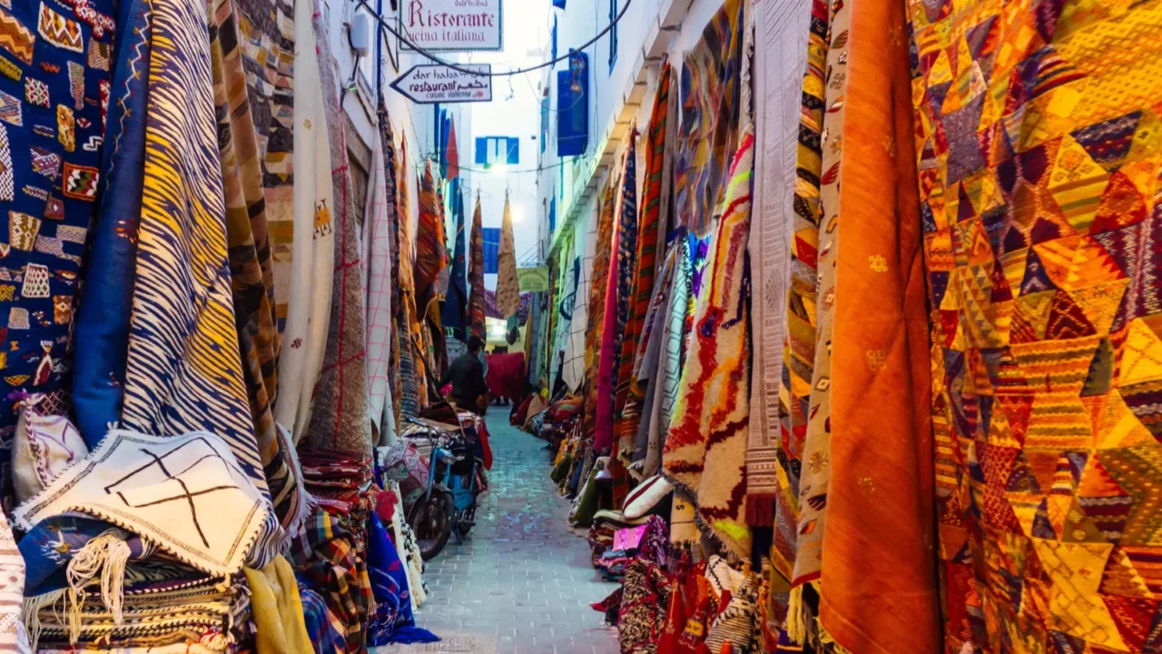 moroccan oriental carpets in a market in medina marrakech morocco