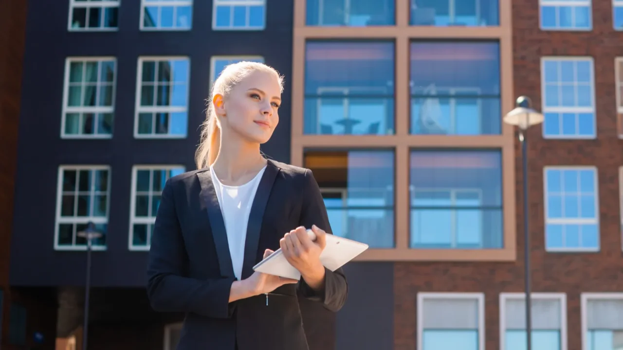 outdoor photo of young and attractive businesswoman retailer or student