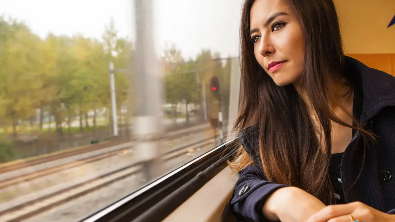 portrait of beautiful young woman with long hairs looks out