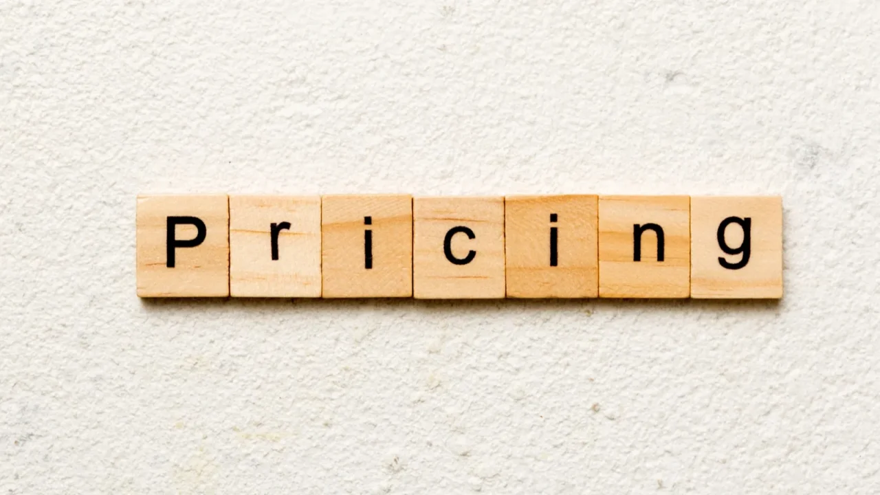 pricing word written on wood block pricing text on table