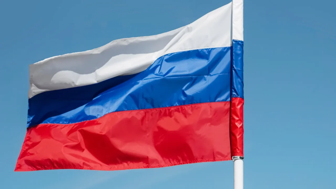 russian tricolor flag waving in the wind against sky