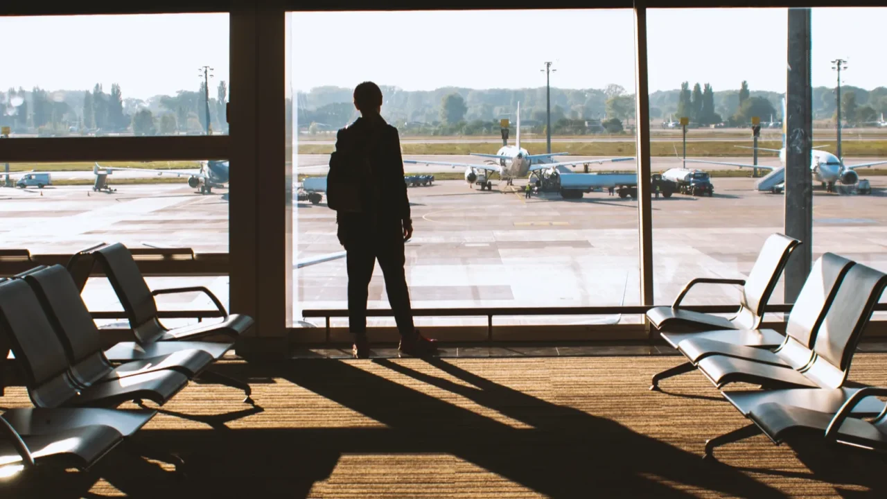 silhouettes of passengers at the airport travel concept