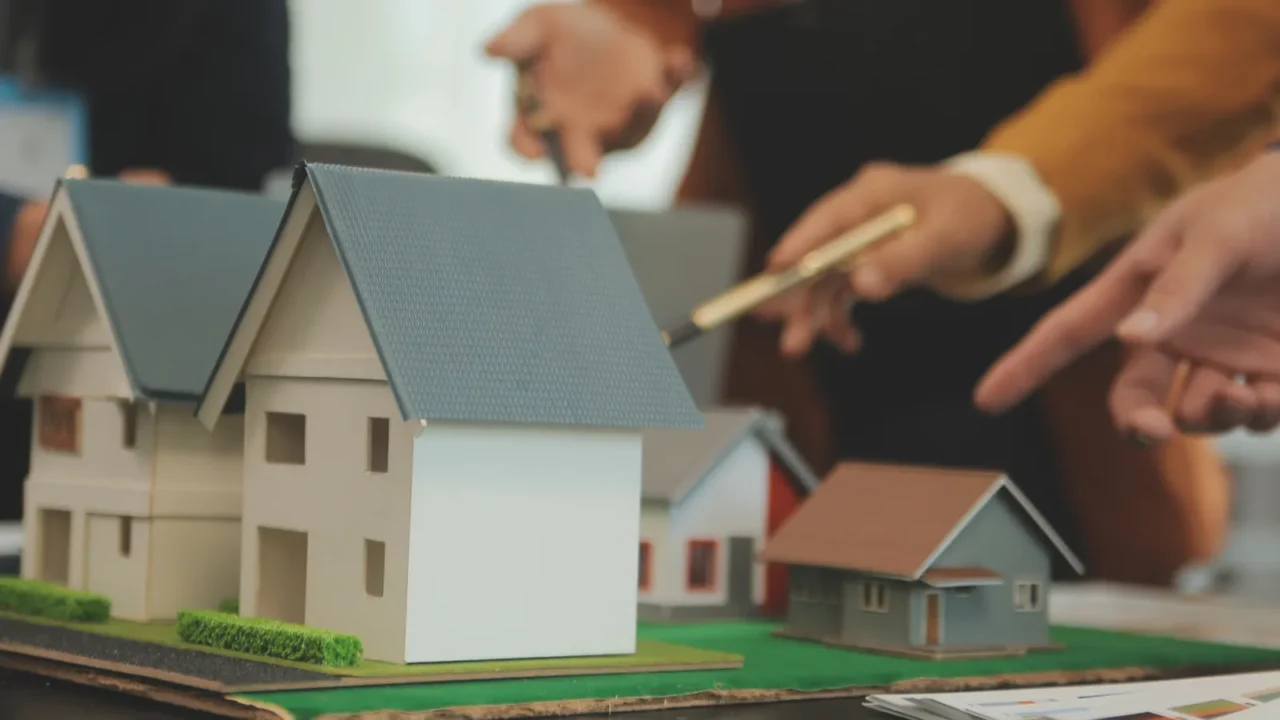 team of architectures and businessmen discussing and brainstorming on floor