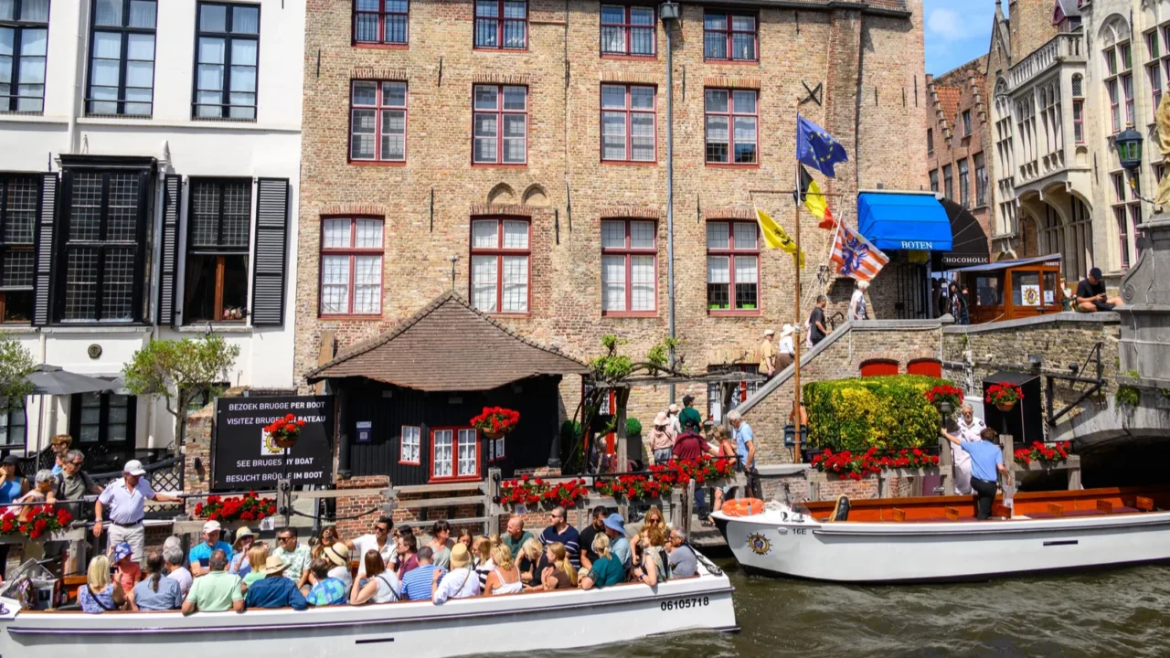 tourists on boats sightseeing historical medieval old town and unesco