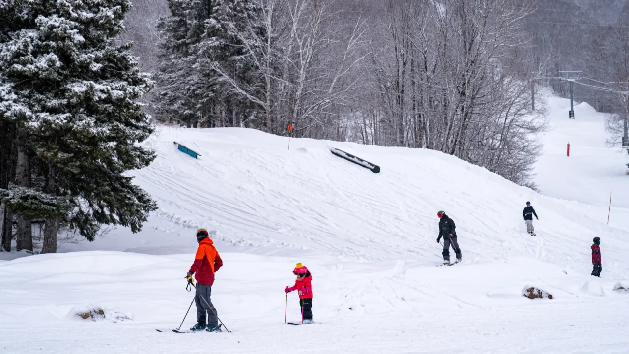 view of people at montsainteanne ski area in winter quebec