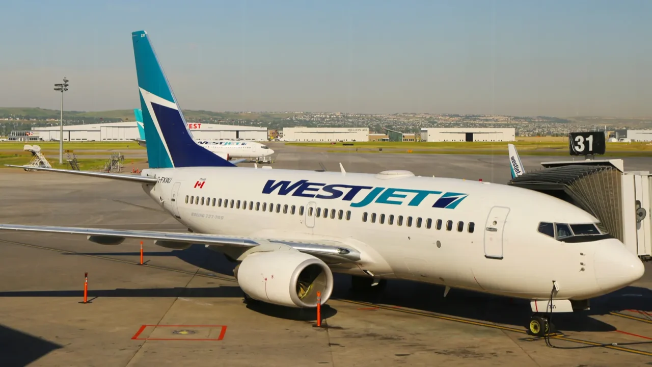 westjet aircraft at the gate at calgary international airport