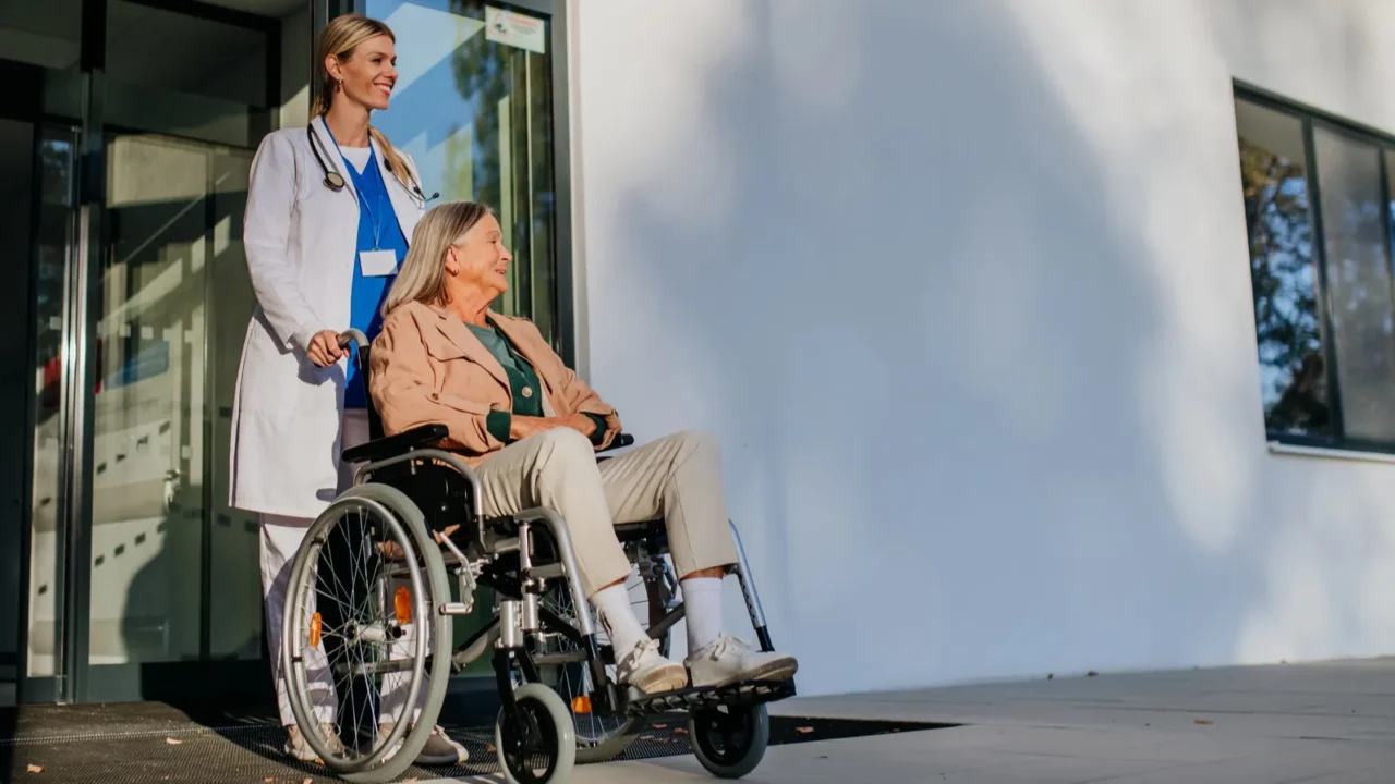 young woman doctor taking care of senior woman at a