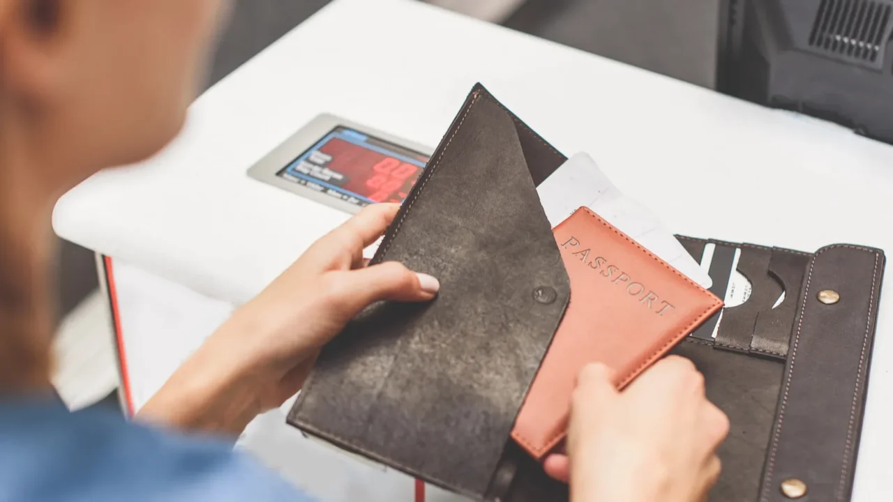 young woman showing documents for departure