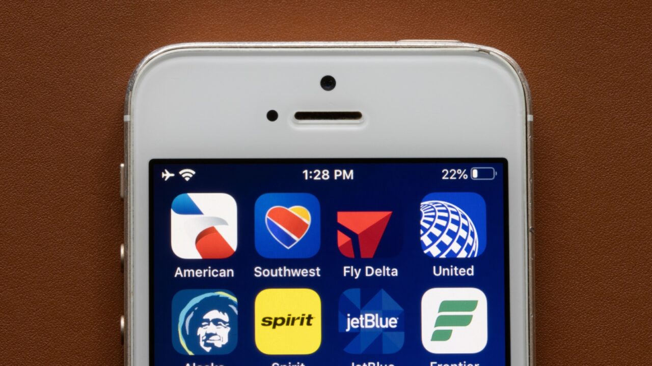 Portland, OR, USA - Mar 6, 2021: Mobile apps by eight major U.S. airlines are seen on iPhone - American, Southwest, Delta, United, Alaska, Spirit, JetBlue, and Frontier.