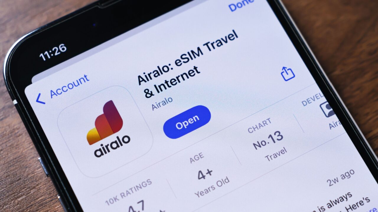 Poznan, Poland - March 26, 2025: Airalo app displayed on a smartphone screen with colorful logo, providing global eSIM solutions for travelers to access mobile internet without roaming