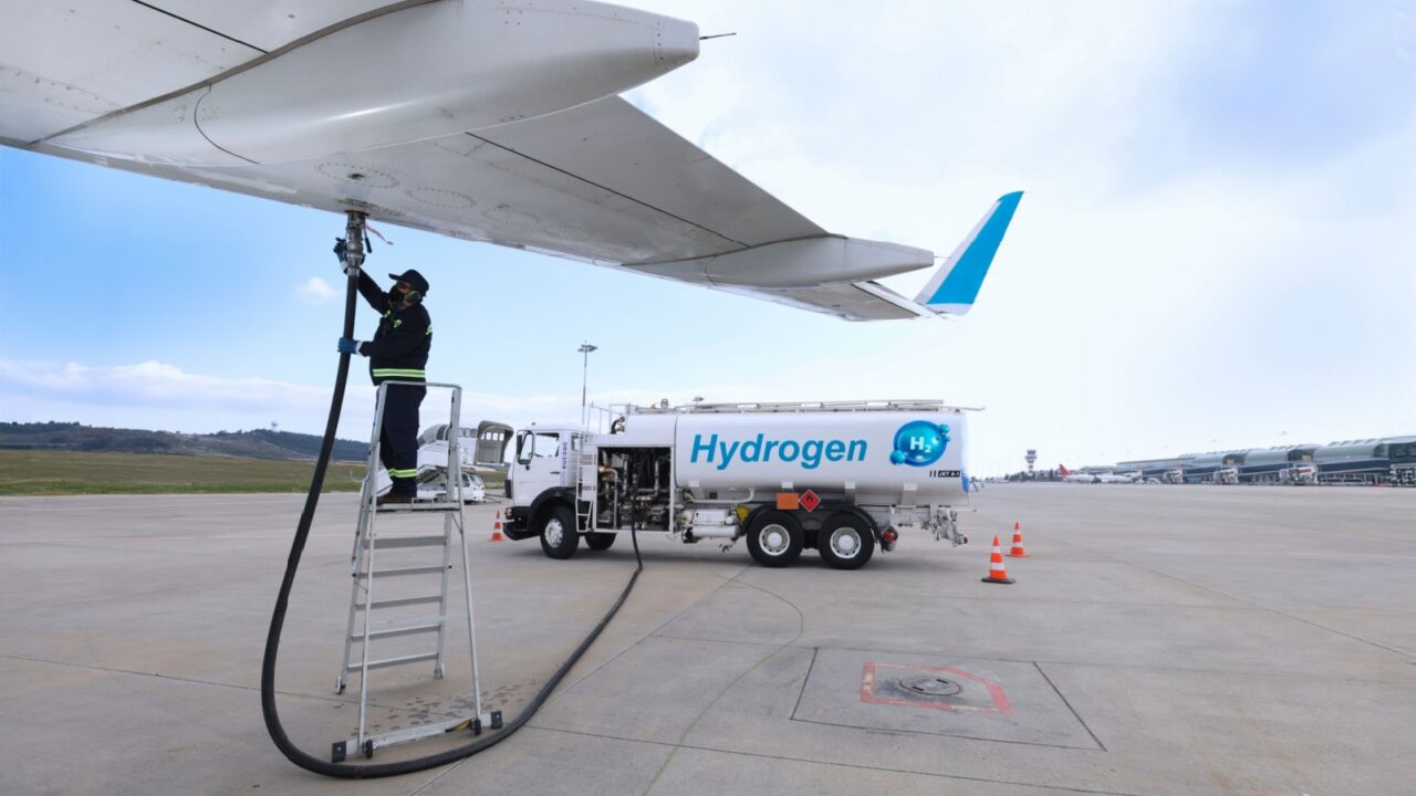 Hydrogen aviation fuel. Technician refueling the aircraft