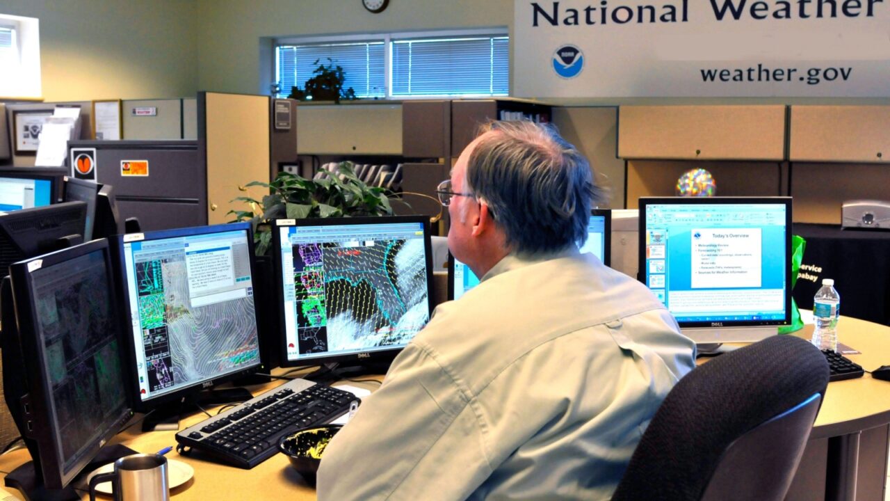 Meteorologist in Work Area in Doppler Radar National Oceanic and Atmospheric Administration NOAA National Weather Service Station Ruskin Florida Tampa Gulf West Central . Created 06.18.25