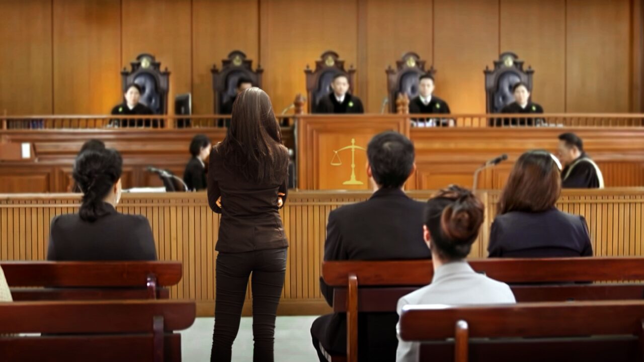 plaintiff or defendant talks to the judge in courtroom. The concept of legal adjustment Court of Justice and Legal Trial Speech to Judge Lawyer Lawyer Protects Client with Argument