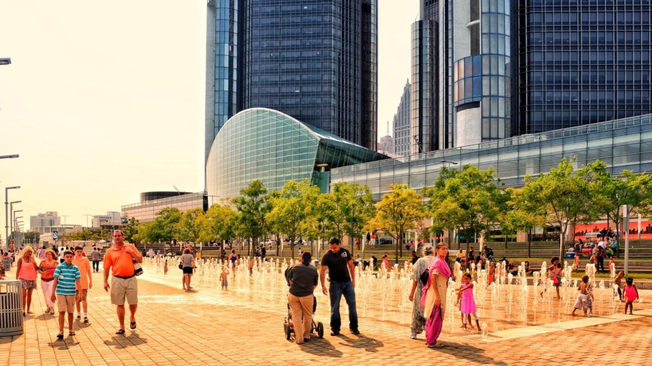 Detroit, Michigan, US- July 4, 2015: Detroit downtown riverside. People enjoying a sunny summer day on the America Independent holiday and celebration. Beautiful cityscape - Detroit RiverWalk