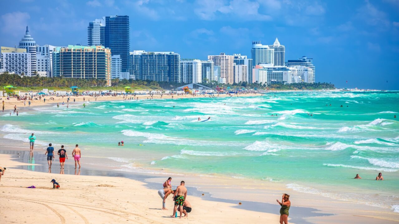 Miami Beach, Florida, USA, March 30 2022: Miami Beach colorful beach and ocean view, Florida state, United States of America. People enjoying winter beach.
