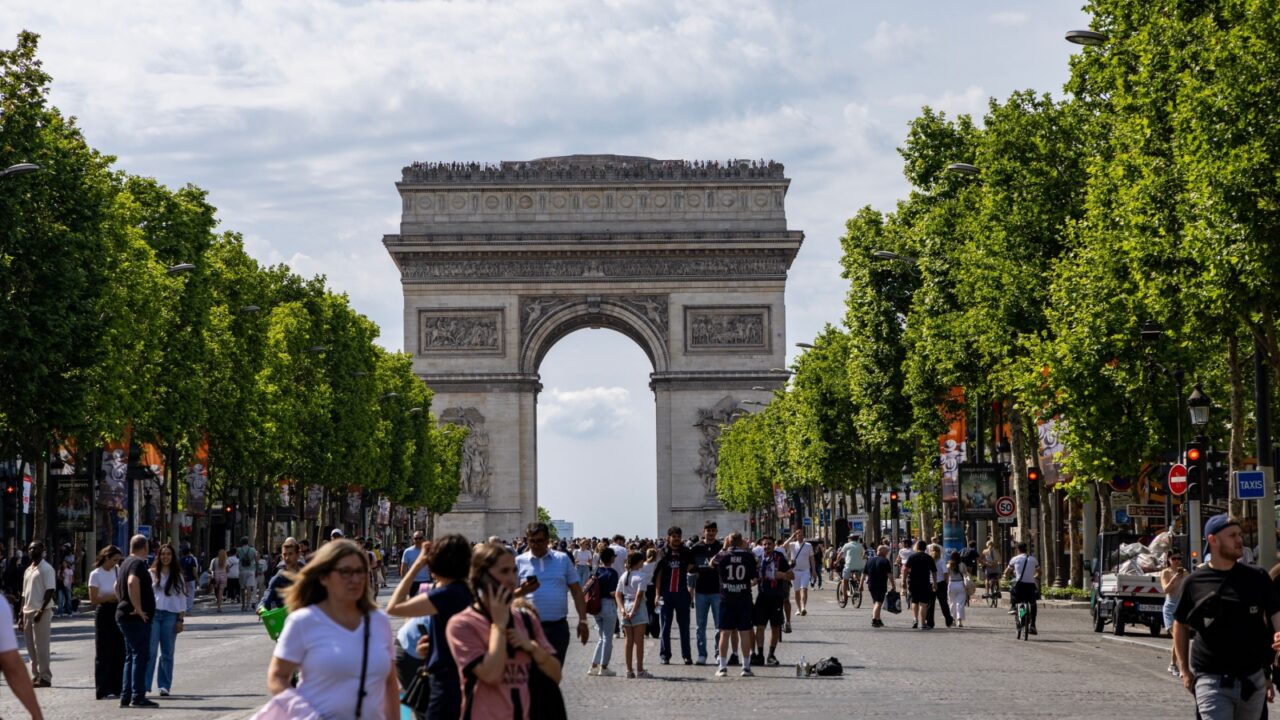 Paris, Tourists Arc de Triomphe on Charles de Gaulle Square. City life. Lifestyle.