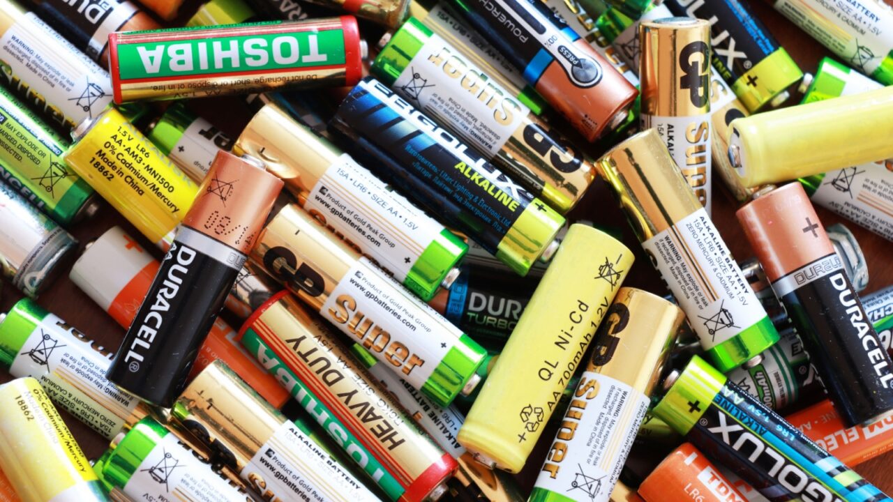 Aktau, Kazakhstan - March 25, 2025: Collection of various battery types including alkaline and heavy duty models.