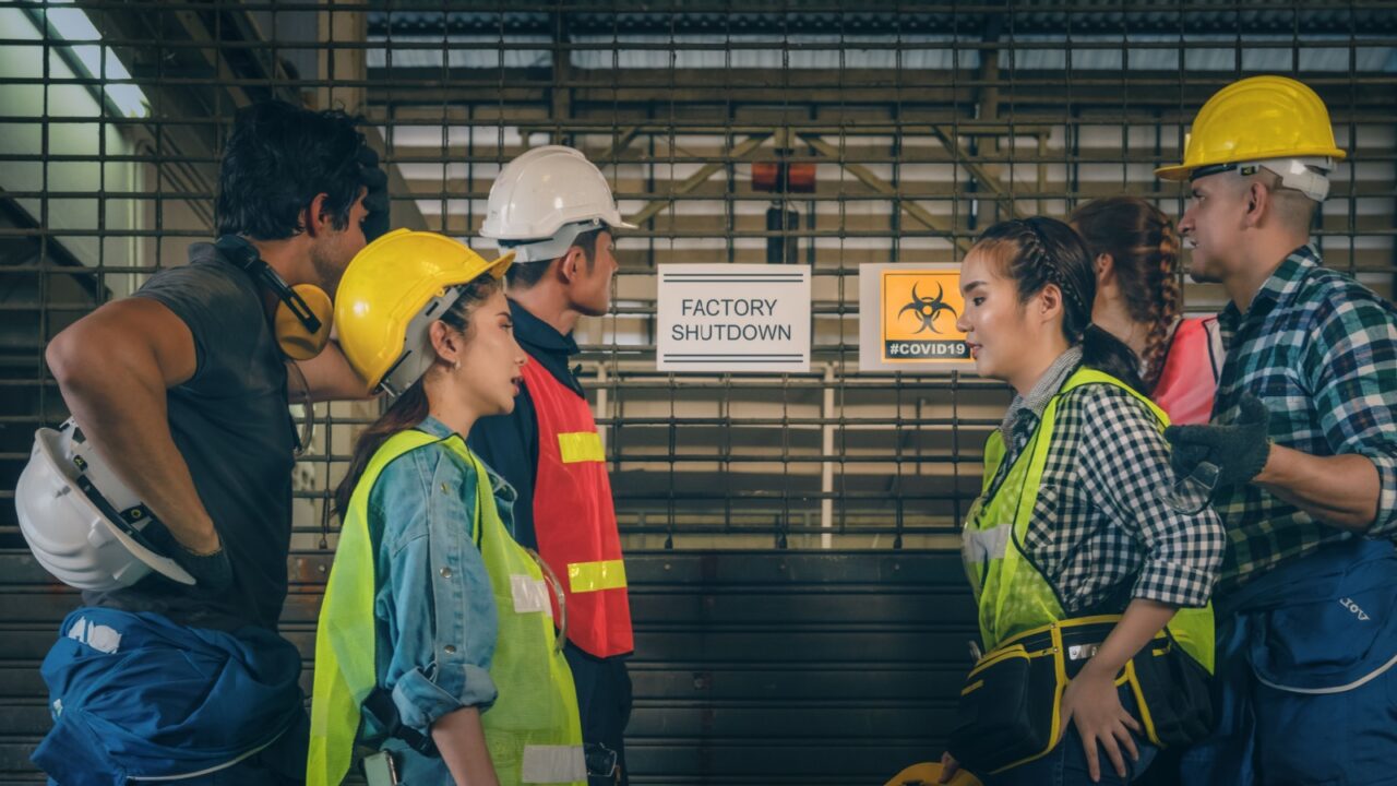 factory workers at factory with layoff annoucement of factory closed due to problem from coronavirus covid 19 outbreak with depressed of job losing and unemployment, problem from coronavirus outbreak