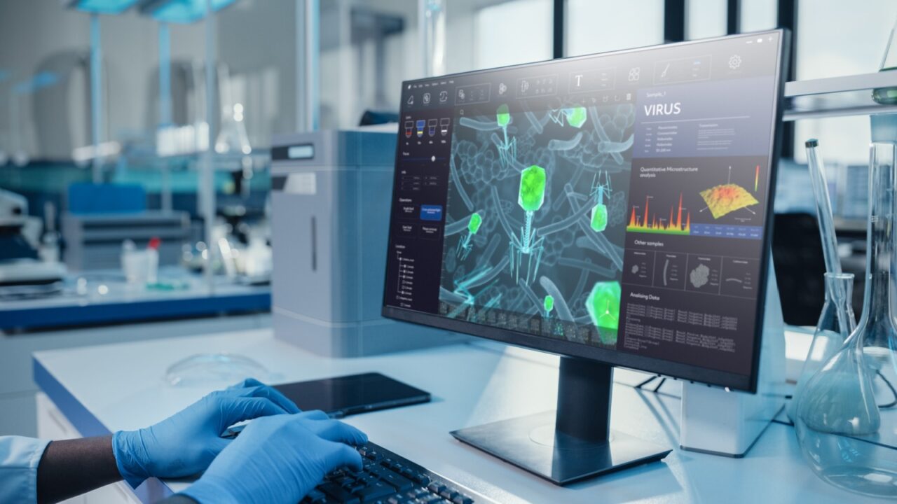 Modern Medical Laboratory: Scientist Wearing Surgical Gloves, Working on Computer, Scren Shows Virus Research Software. Advanced Scientific Lab, Medicine Biotechnology Development