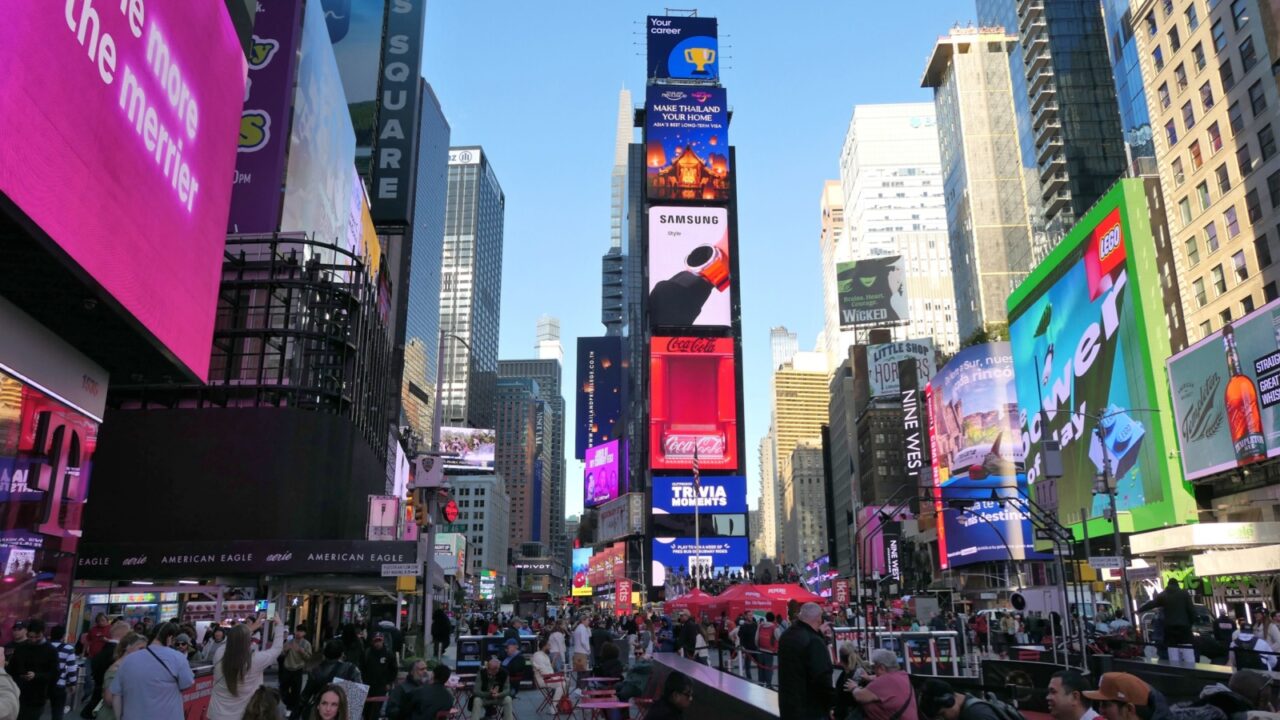 New York City, USA - November 11, 2024: Tourists on Times Square, Manhattan in New York City during the day. Times Square is one of the world's most visited tourist attractions.