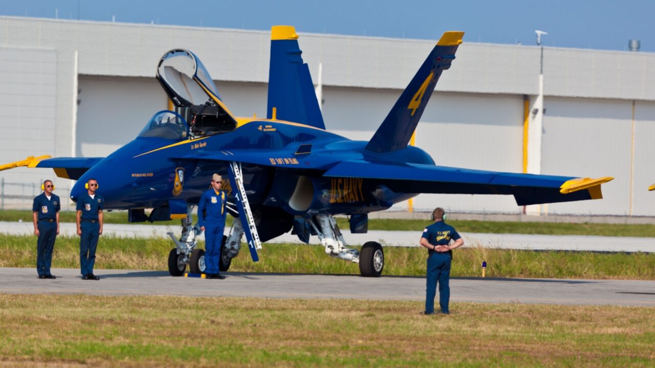 PENSACOLA, FL - NOVEMBER 11: The US Navy Blue Angels in F-18 Hornet planes perform in air show routine in Pensacola, FL on November 11, 2011. The Blue Angels are the oldest active aerobatic team in the world.