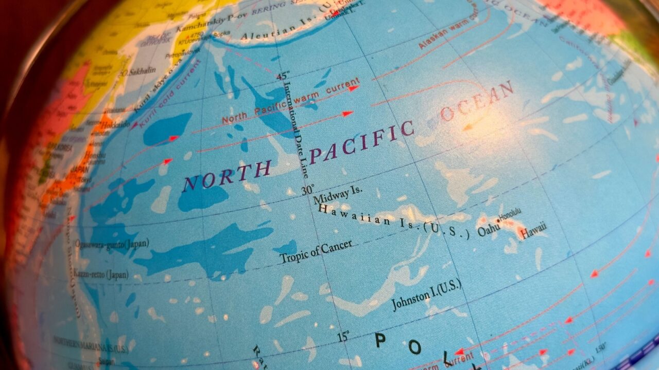 Bandung, Indonesia, 02 23 2025 : Closeup of globe map showing the North Pacific Ocean, including Hawaii, Midway Islands, Johnston Atoll, ocean currents. Selective focus.