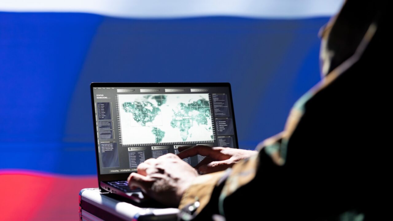Russian military operative uses laptop to analyze surveillance data,