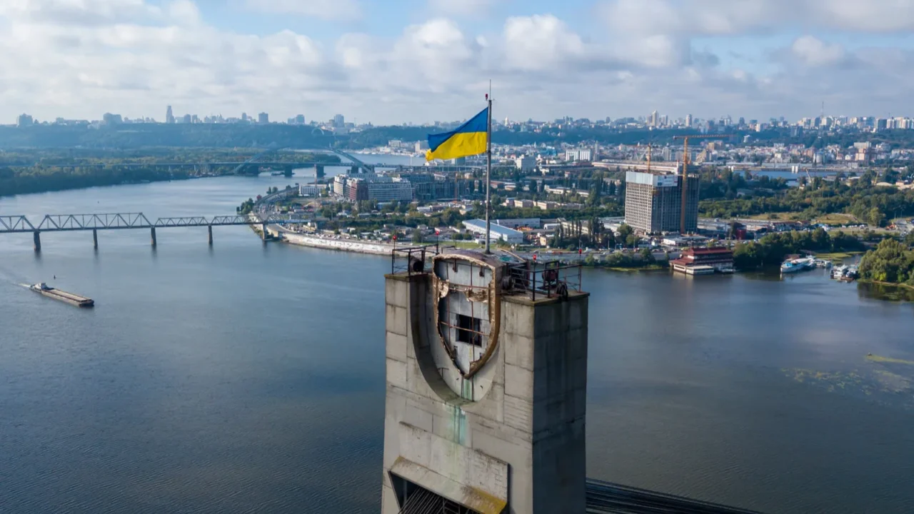 aerial drone view flag of ukraine on the north bridge