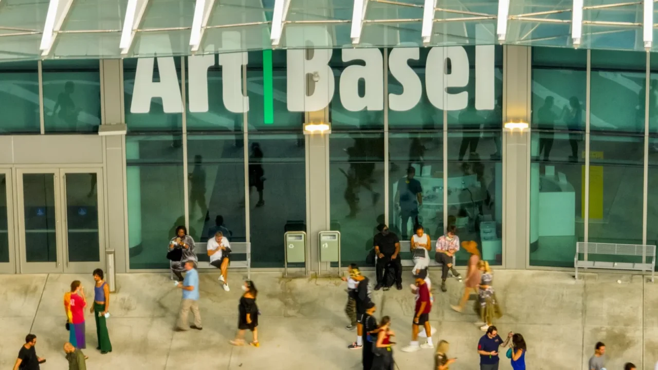 aerial photo people walking by the art basel miami beach