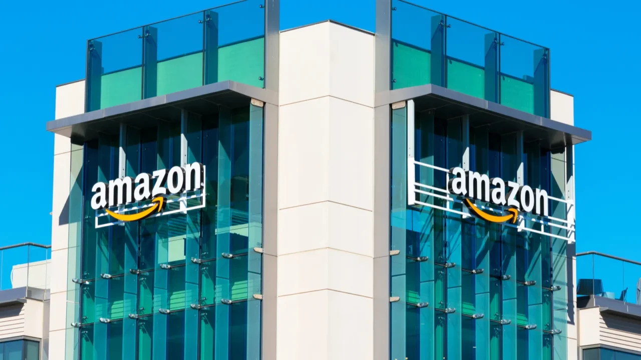 amazon logo with its signature orange smile on the glass