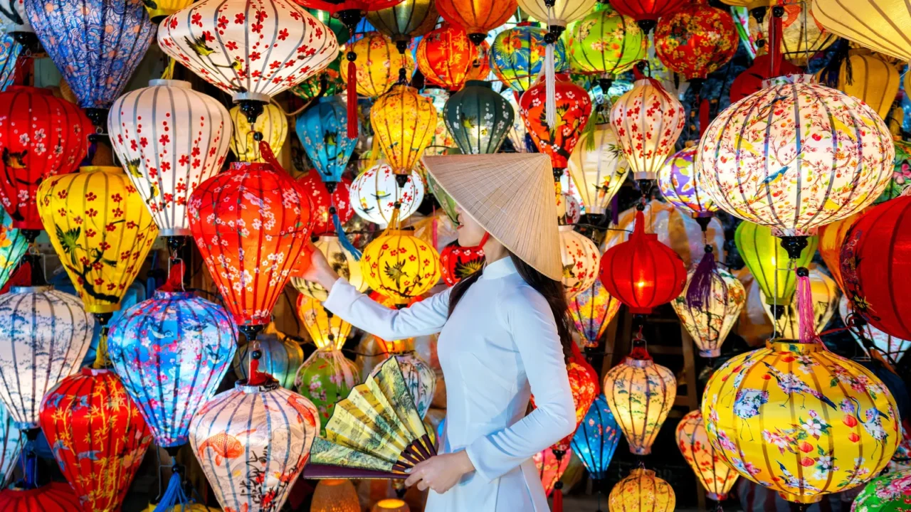 asian woman wearing vietnam culture traditional and hoi an lanterns