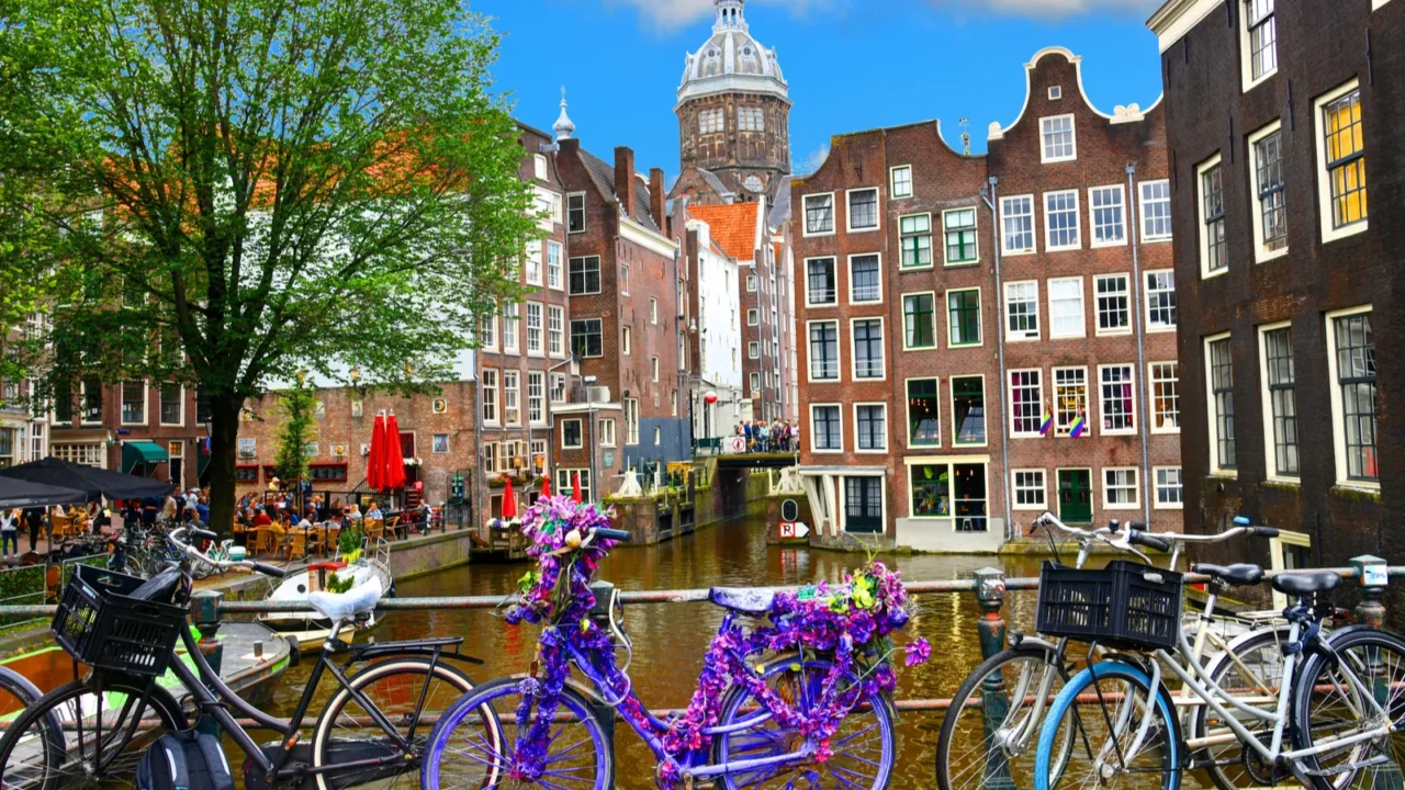 bicycles over canal amsterdam city picturesque landscape in the nitherlands
