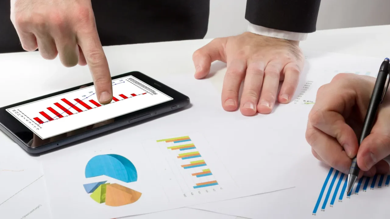 business people on a meeting analyzing financial reports