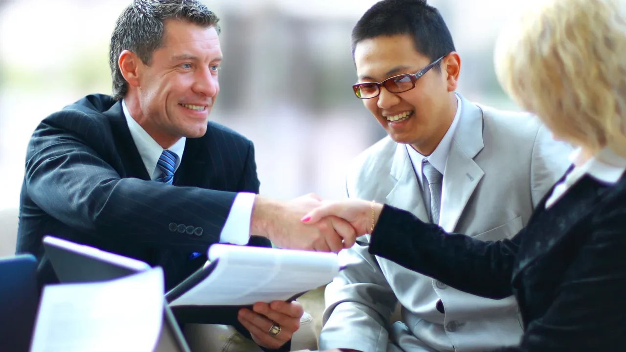 business shaking hands finishing up a meeting