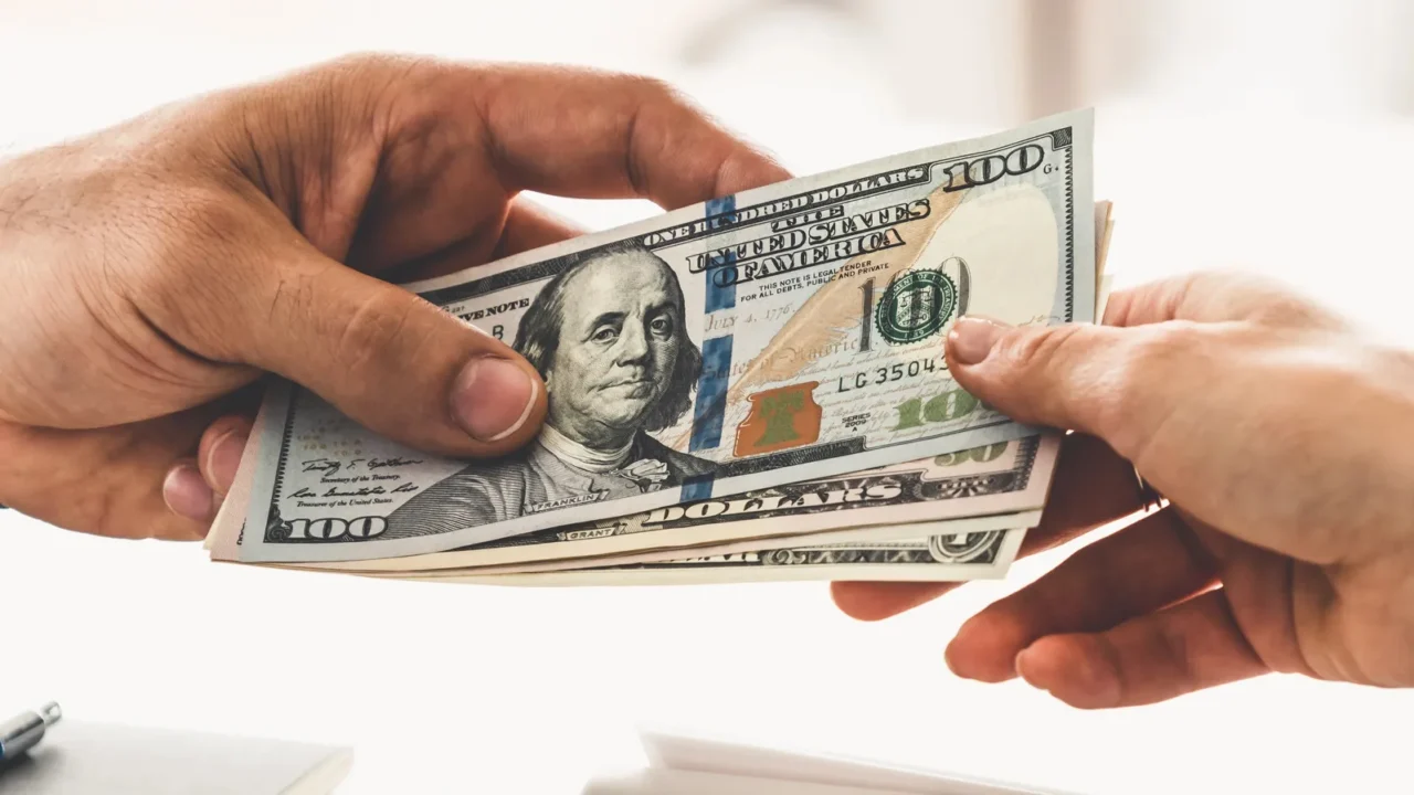 businessman hand sending money to another business person transaction payment