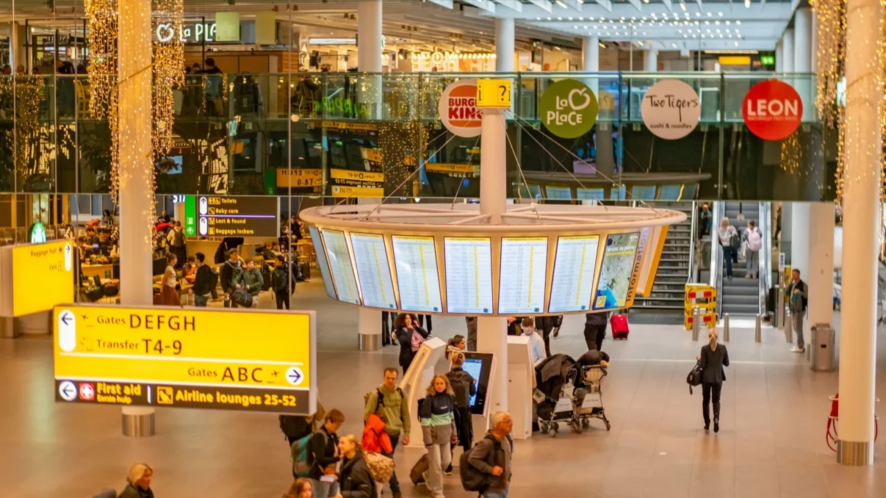 busy airport terminal with travelers flight info screens modern travel