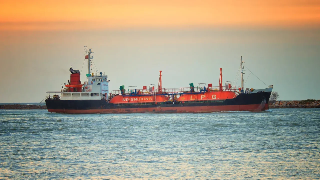 cargo ship against colorful sunset