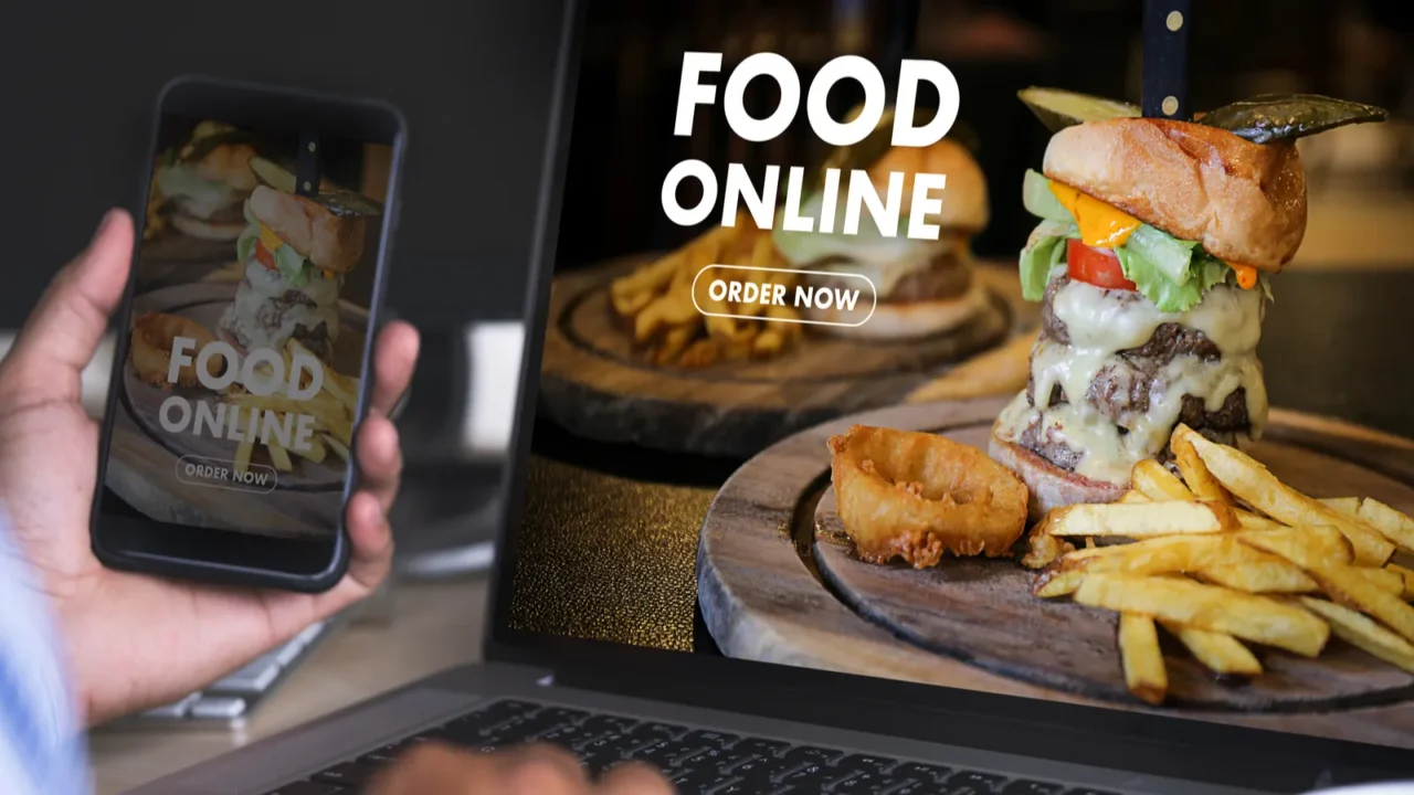 close up woman ordering food online by internet
