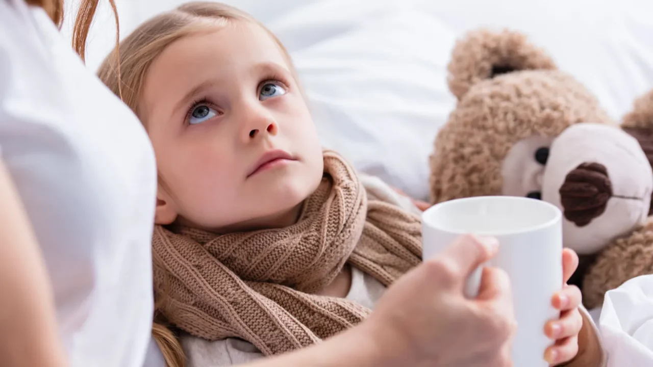 cropped image of mother taking care of sick daughter in