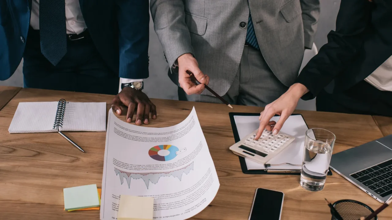 cropped view of business colleagues doing paperwork