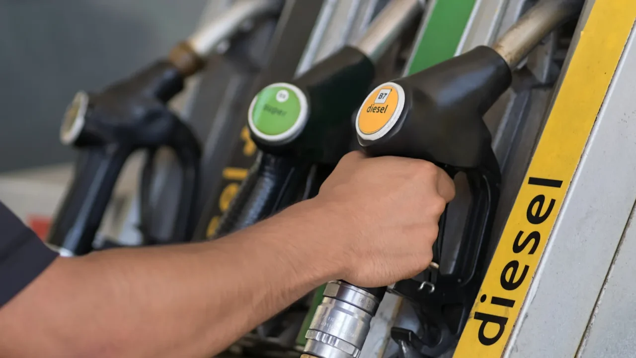 cropped view of the man preparing refuelling his car at