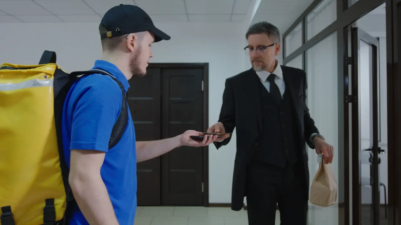 delivery boy arriving with food