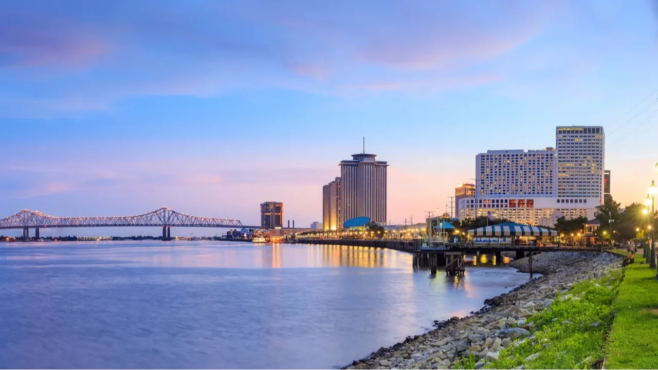 Downtown New Orleans, Louisiana and the Missisippi River at twilight.