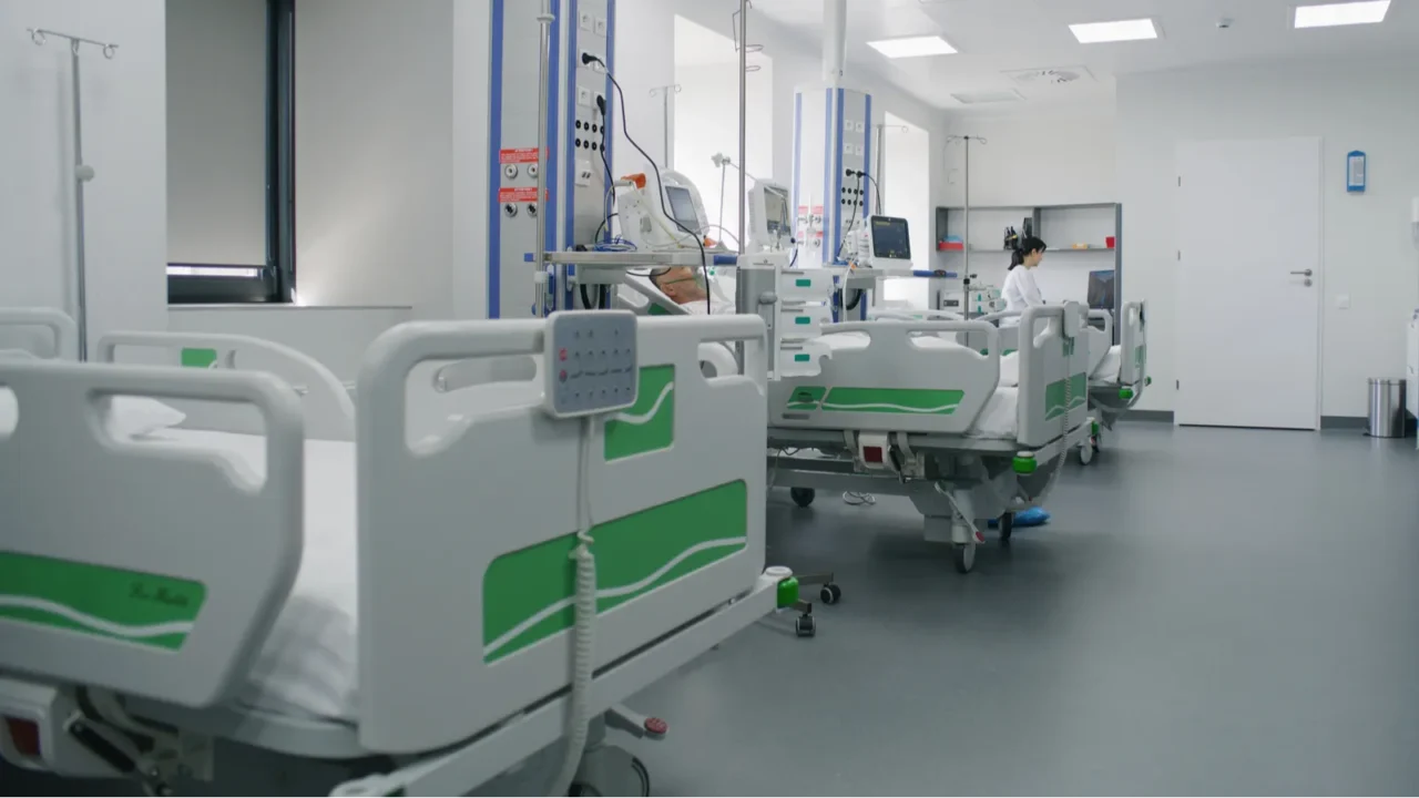 emergency room with modern equipment in hospital elderly man in