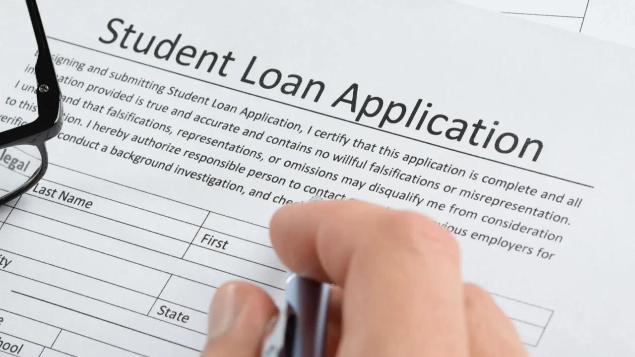 hand with pen over application