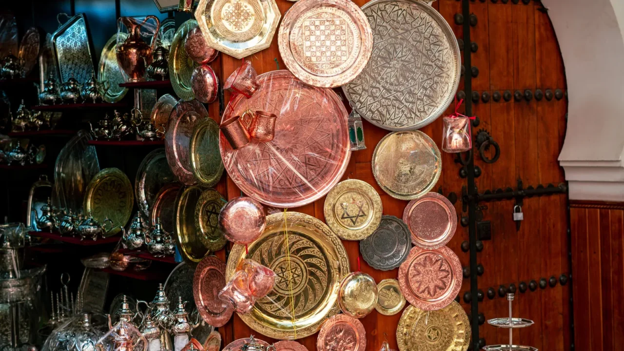 handmade copper products outside a bazaar in the old medina