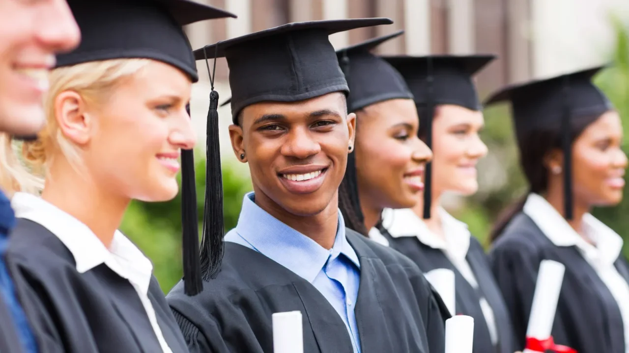 multiracial graduation standing in a row