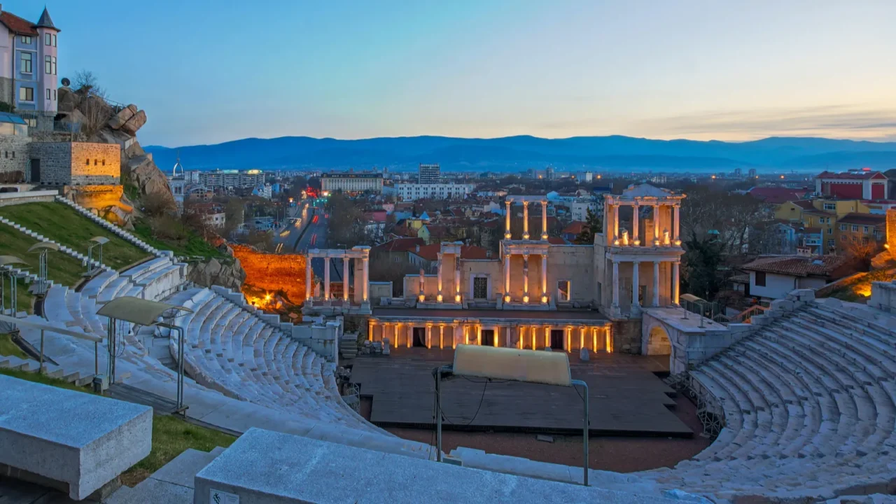 night panorama of city of plovdiv and ancient roman theatre