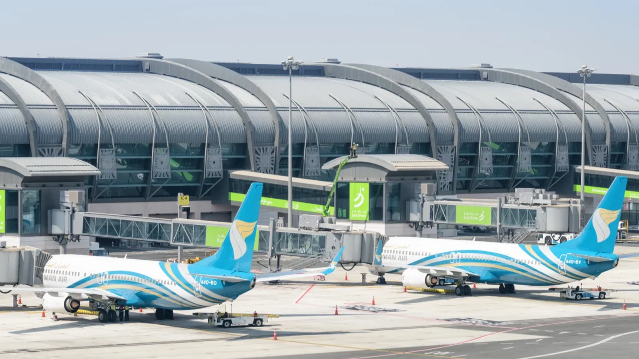 oman air aircraft parked at muscat international airport