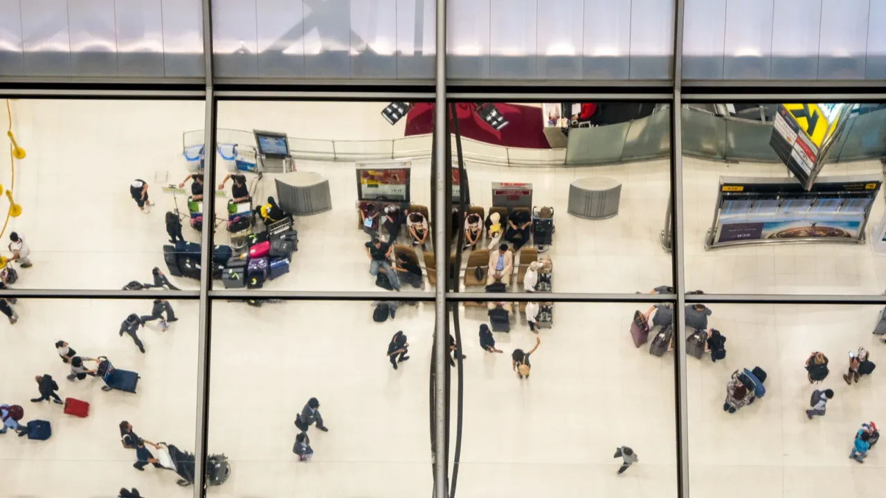 reflection glass of top view people in line queue with